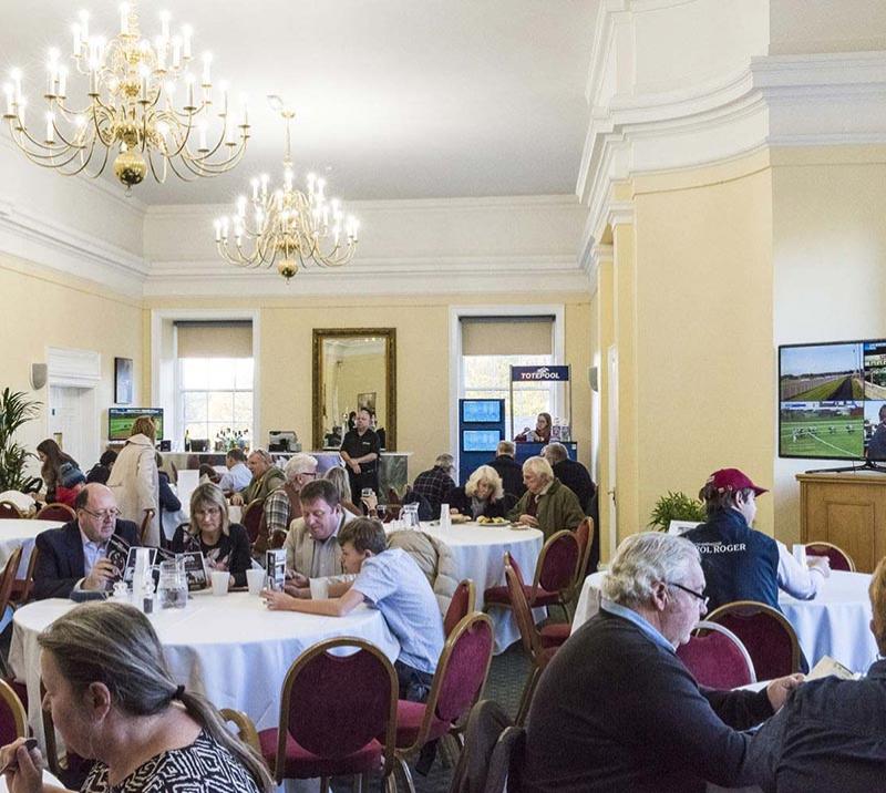 A full room enjoying afternoon dining and refreshments.