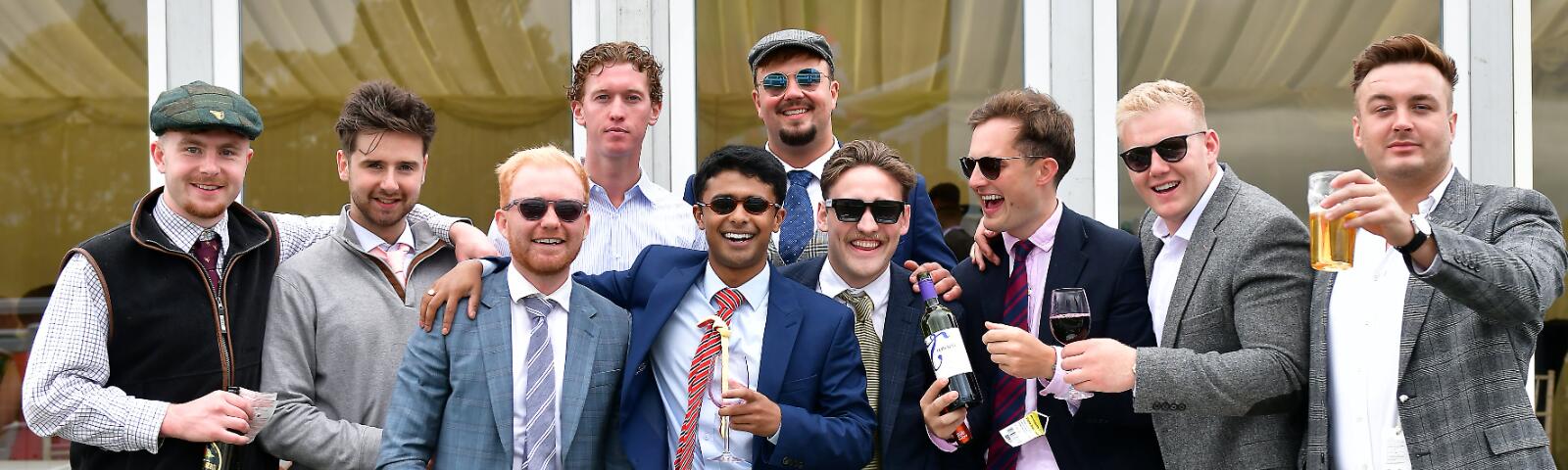 A large group of gentlemen enjoying Newcastle Races
