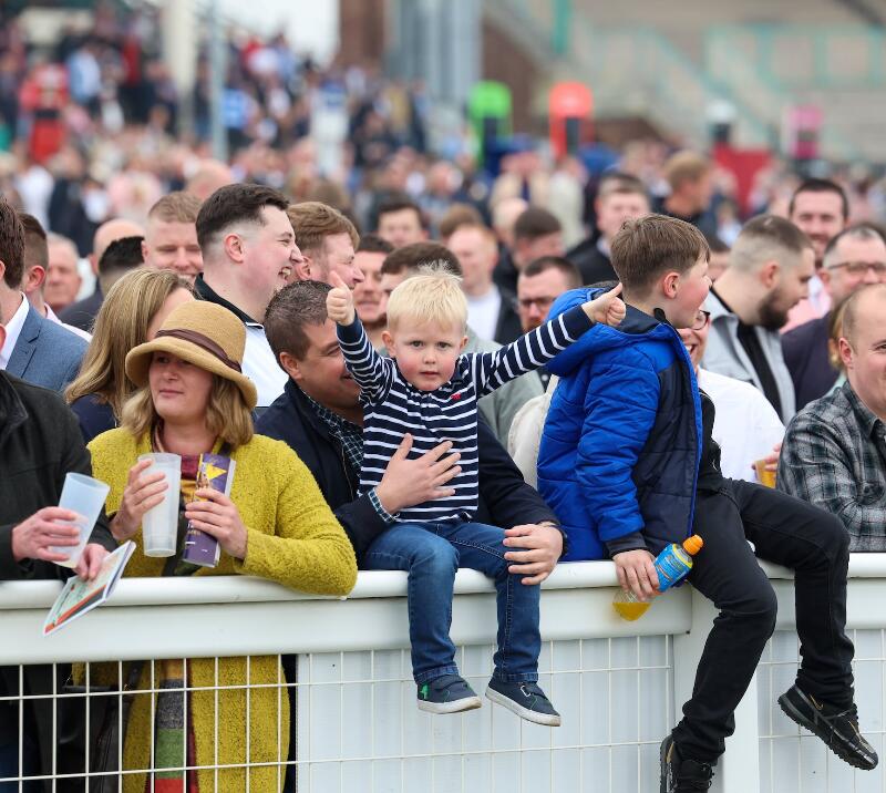 A family in the crowd cheering.